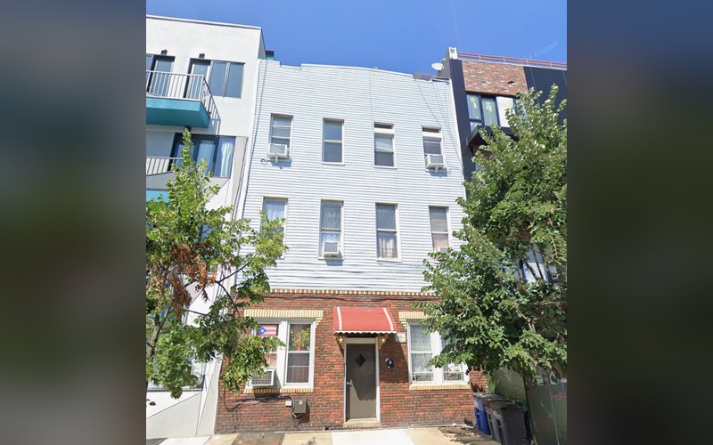 279-281 Evergreen Avenue, a three-story Bushwick multifamily building with a brick base
